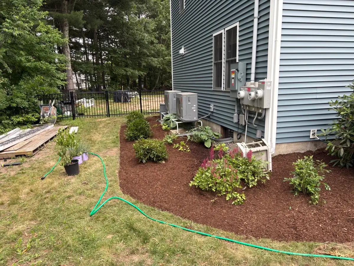 Garden bed with a fresh layer of mulch and a crisp curved edge